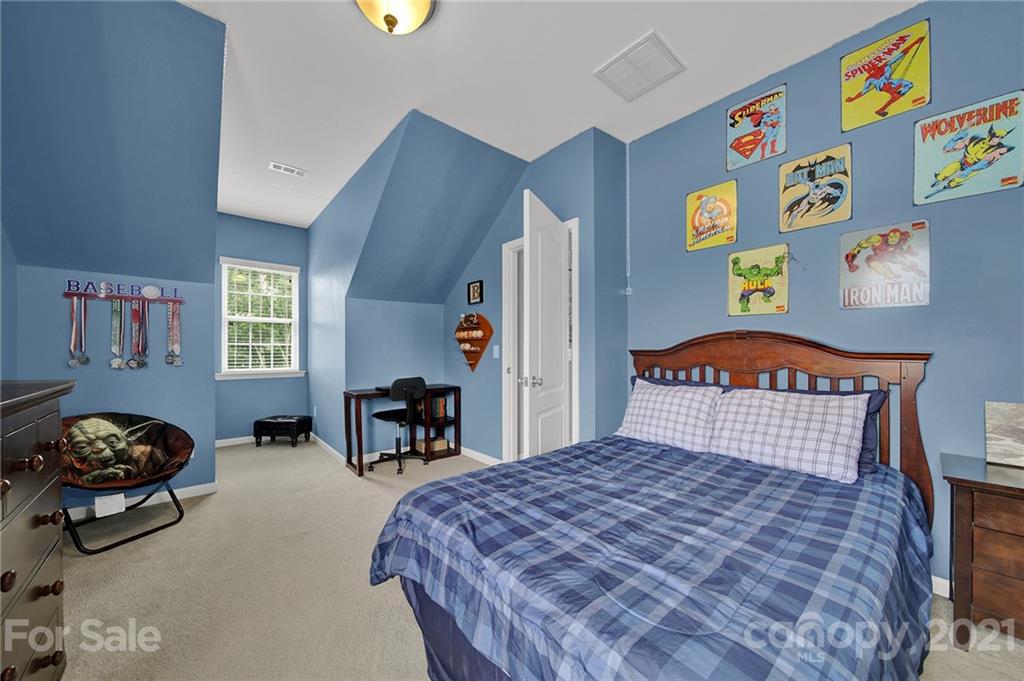 324 Miners Cove Way Fort Mill, SC 29708 - Photo 27 of 48 a bedroom with a bed and dresser