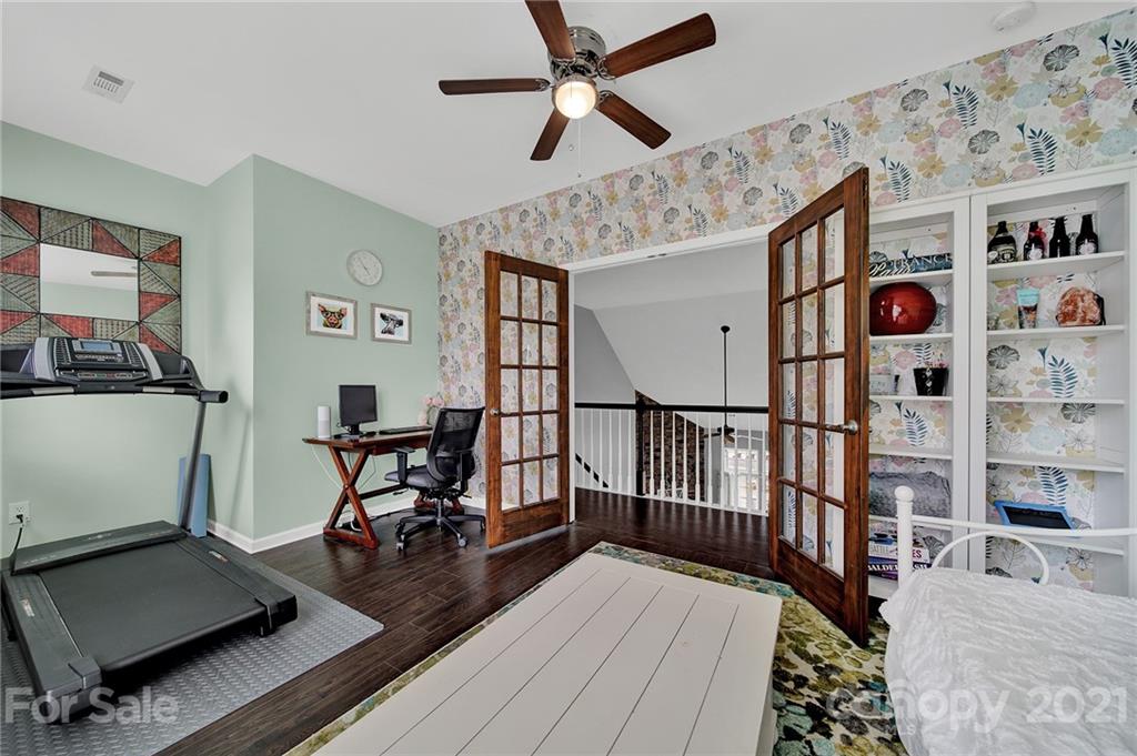 324 Miners Cove Way Fort Mill, SC 29708 - Photo 30 of 48 a view of a room with furniture and wooden floor