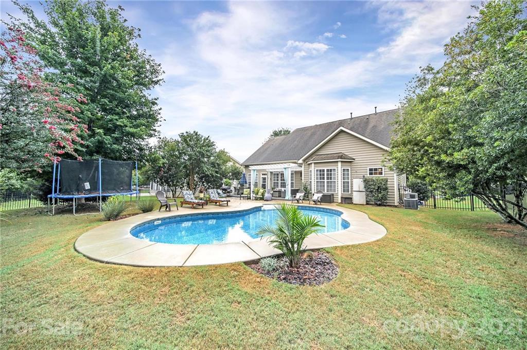 324 Miners Cove Way Fort Mill, SC 29708 - Photo 38 of 48 a view of a house with swimming pool and yard