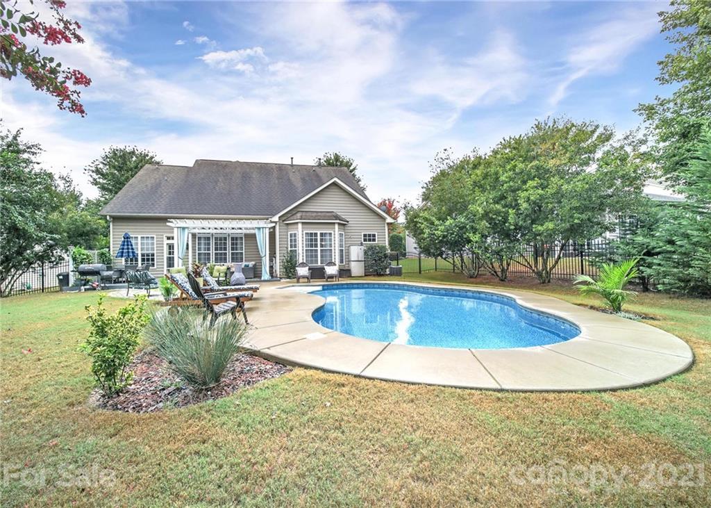324 Miners Cove Way Fort Mill, SC 29708 - Photo 39 of 48 a view of a house with swimming pool and sitting area