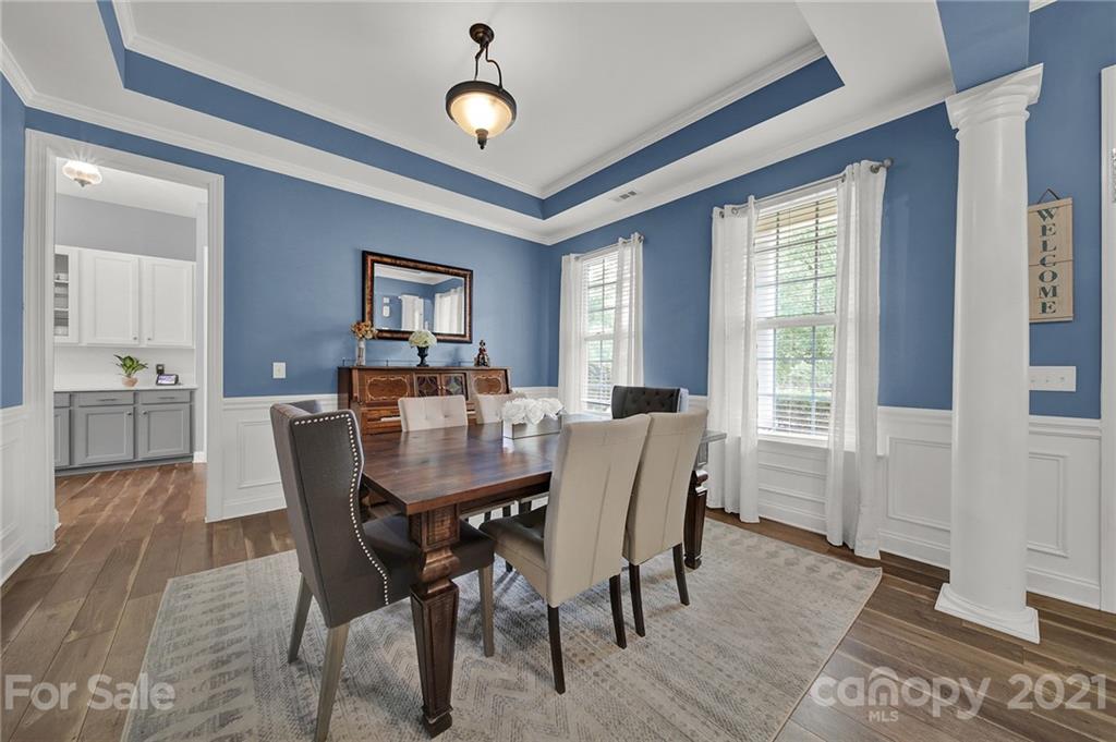324 Miners Cove Way Fort Mill, SC 29708 - Photo 5 of 48 a view of a dining room with furniture window and wooden floor