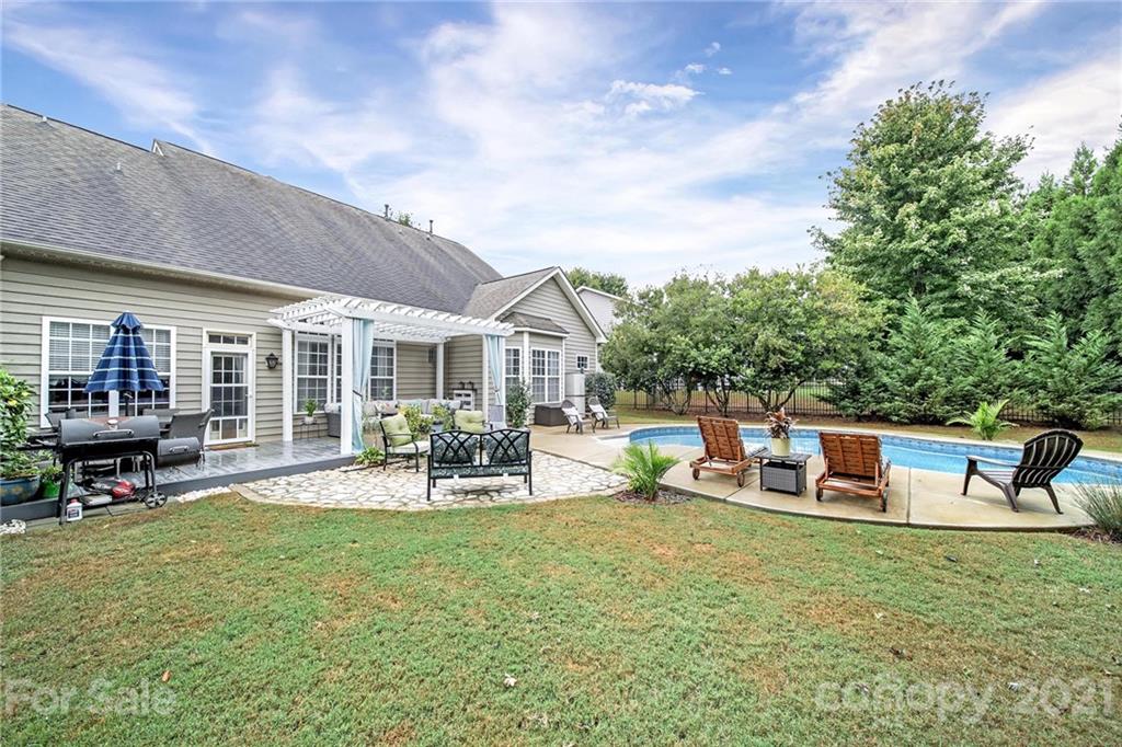 324 Miners Cove Way Fort Mill, SC 29708 - Photo 41 of 48 a view of a house with backyard porch and sitting area