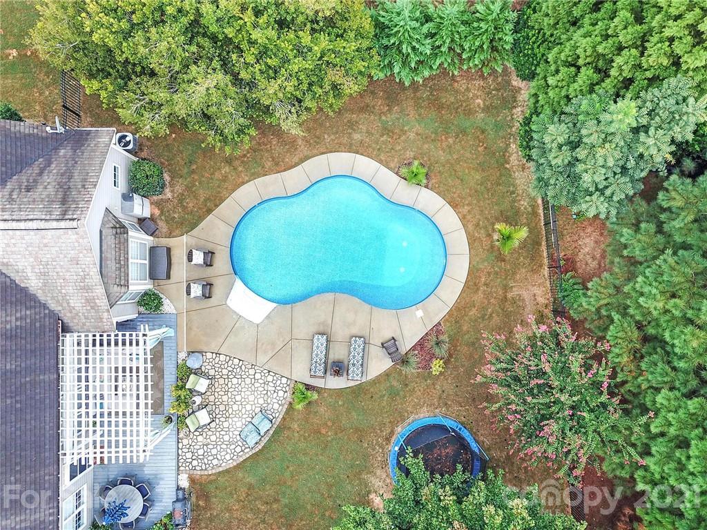 324 Miners Cove Way Fort Mill, SC 29708 - Photo 43 of 48 an aerial view of a house with swimming pool and trees