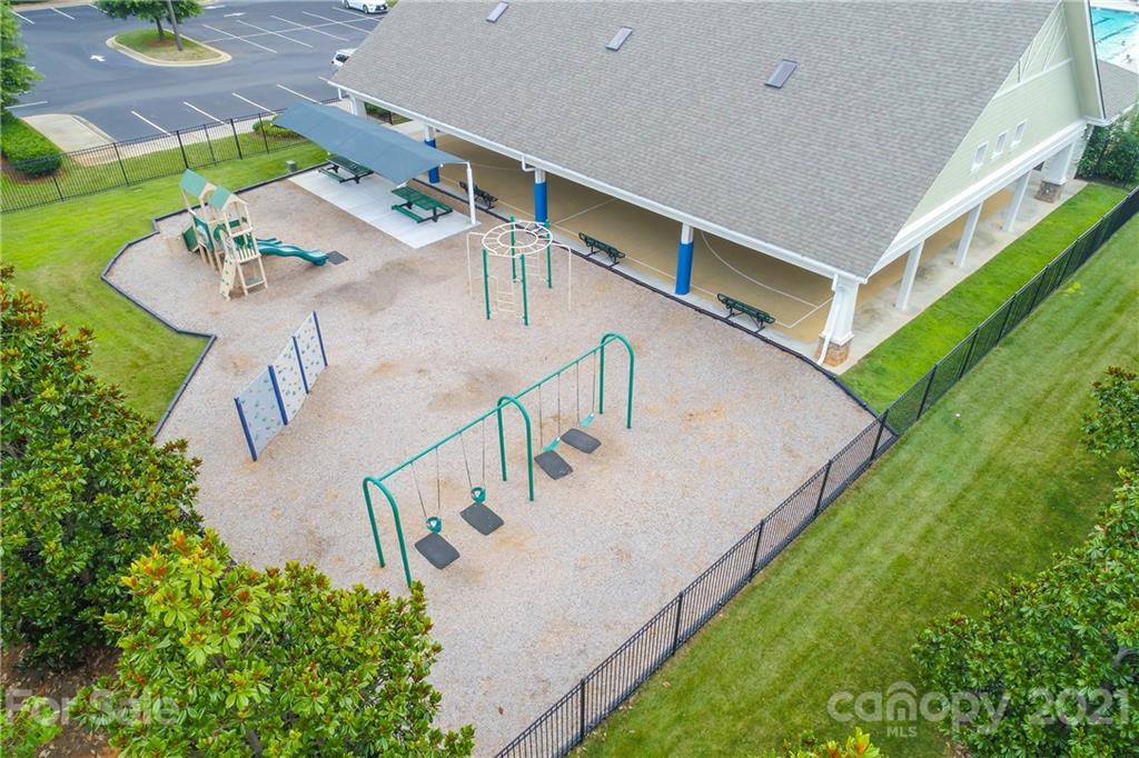 324 Miners Cove Way Fort Mill, SC 29708 - Photo 45 of 48 a view of a house with pool and furniture