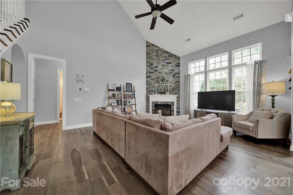 324 Miners Cove Way Fort Mill, SC 29708 - Photo 8 of 48 a living room with furniture and a fireplace
