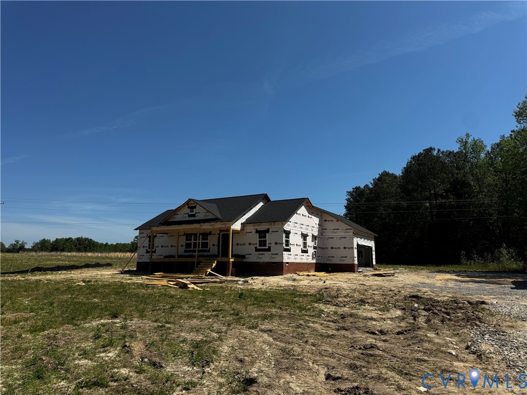11051 Easy Street Disputanta, VA 23842 - Photo 5 of 11 a front view of a house with a yard