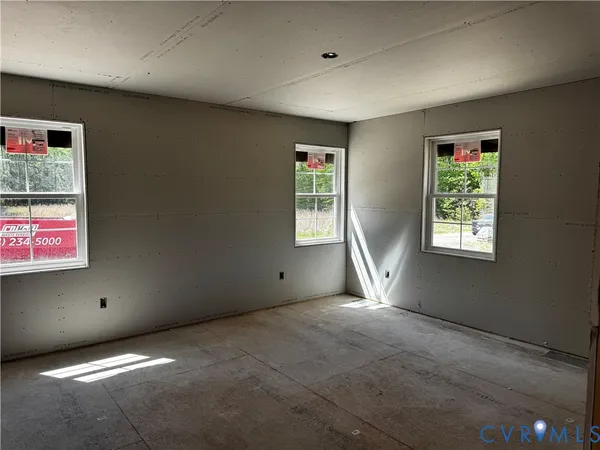 an empty room with windows