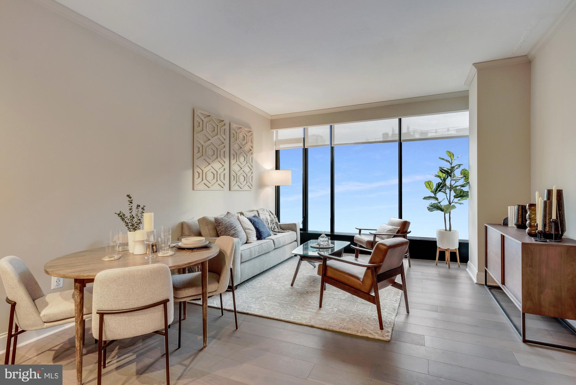 30 North 23rd Street, Unit 2003 Philadelphia, PA 19103 - Photo 9 of 42 a living room with furniture and wooden floor