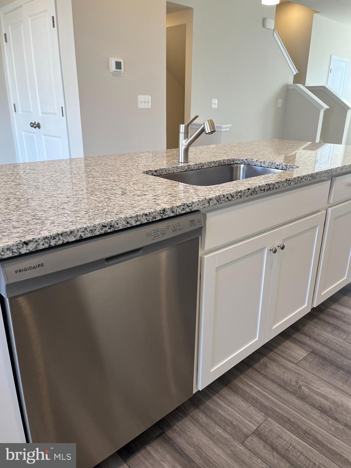 121 Canning Road Inwood, WV 25428 - Photo 19 of 38 a bathroom with a granite countertop sink and a mirror