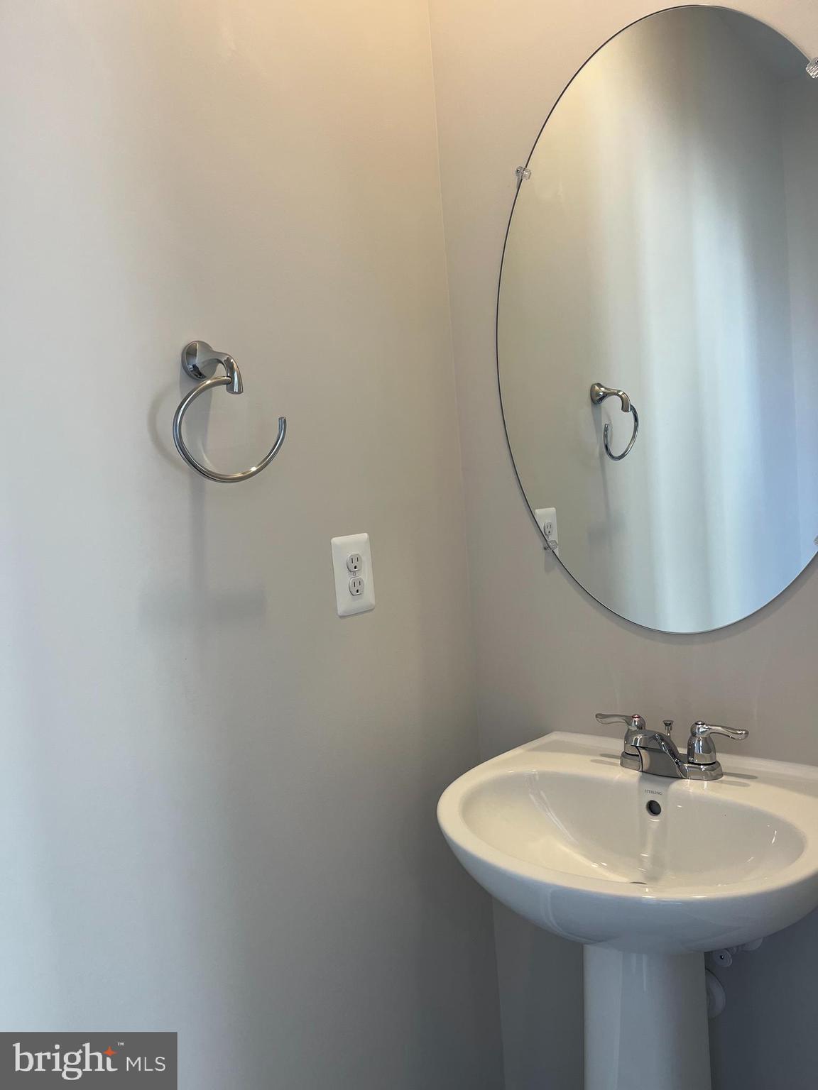 121 Canning Road Inwood, WV 25428 - Photo 22 of 38 a bathroom with a sink a mirror and vanity