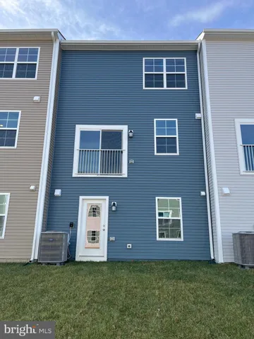 a house that has a large window in front of it