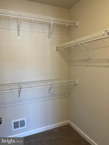 a view of a room with racks on the wall