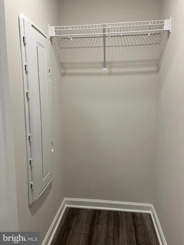 a view of storage and utility room with racks on the wall