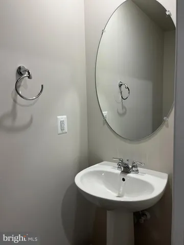 a bathroom with a sink a mirror and vanity