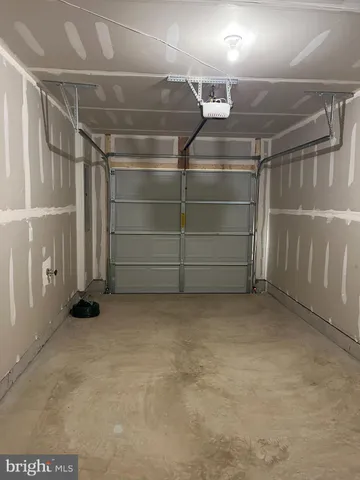 a view of an empty room with racks on the wall