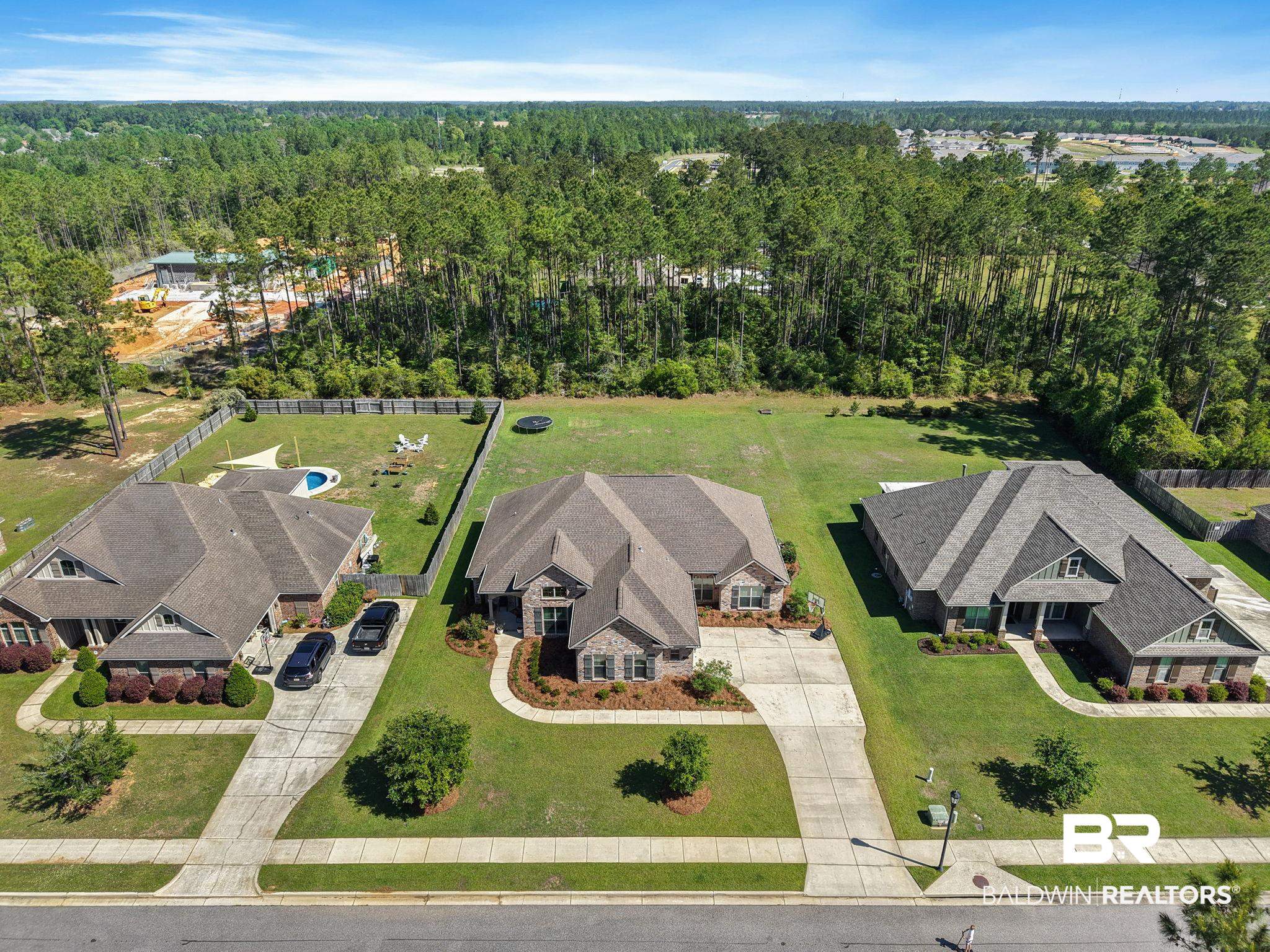 31911 Bobwhite Road Daphne, AL 36527 - Photo 73 of 85 Aerial view of residential area with a forest