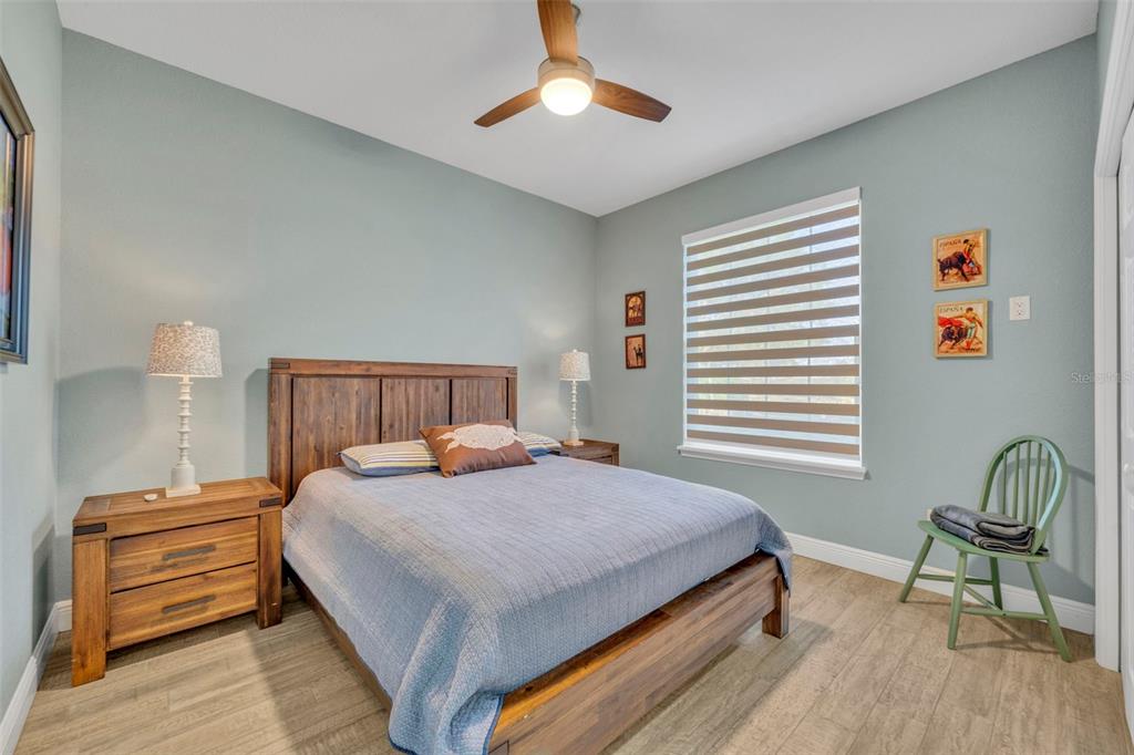 1947 North Lake Reedy Boulevard Frostproof, FL 33843 - Photo 17 of 31 a bedroom with a bed and a chandelier