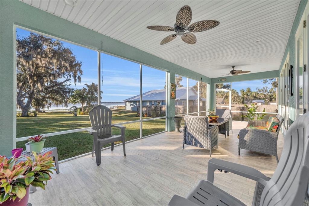 1947 North Lake Reedy Boulevard Frostproof, FL 33843 - Photo 20 of 31 a living room filled with furniture and a floor to ceiling window