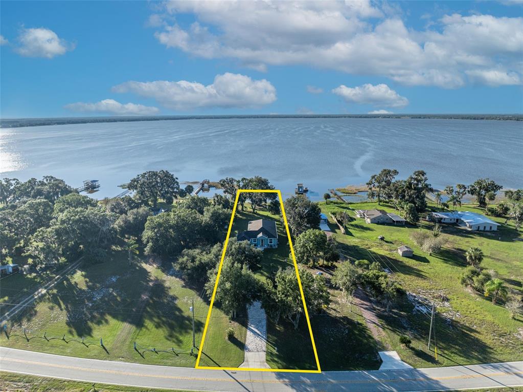 1947 North Lake Reedy Boulevard Frostproof, FL 33843 - Photo 2 of 31 a aerial view of a yard