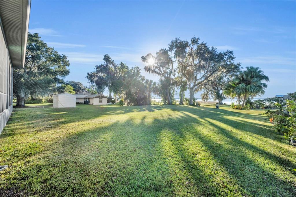 1947 North Lake Reedy Boulevard Frostproof, FL 33843 - Photo 23 of 31 a view of a park with large trees