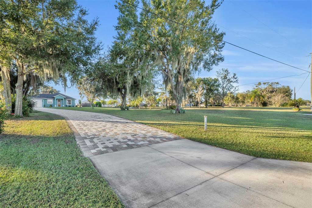 1947 North Lake Reedy Boulevard Frostproof, FL 33843 - Photo 26 of 31 a view of a swimming pool and a yard