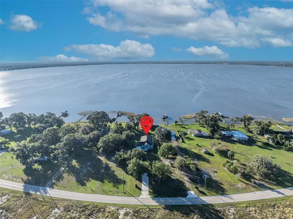 a view of a garden with a table and a chair
