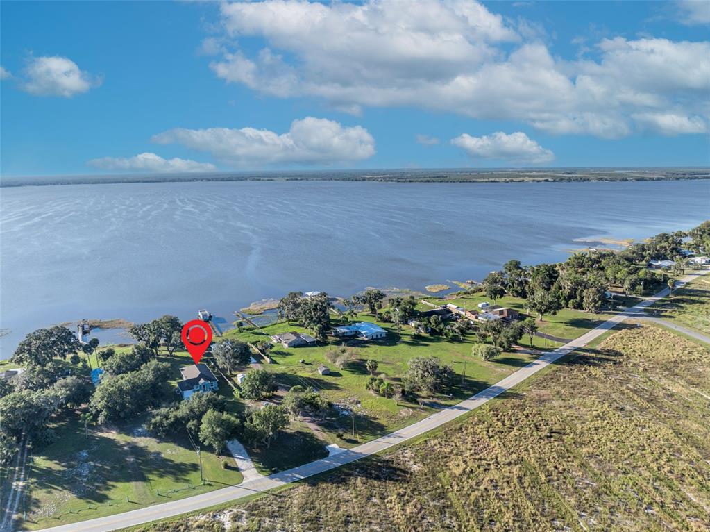 1947 North Lake Reedy Boulevard Frostproof, FL 33843 - Photo 29 of 31 a view of a garden with a table and a chair
