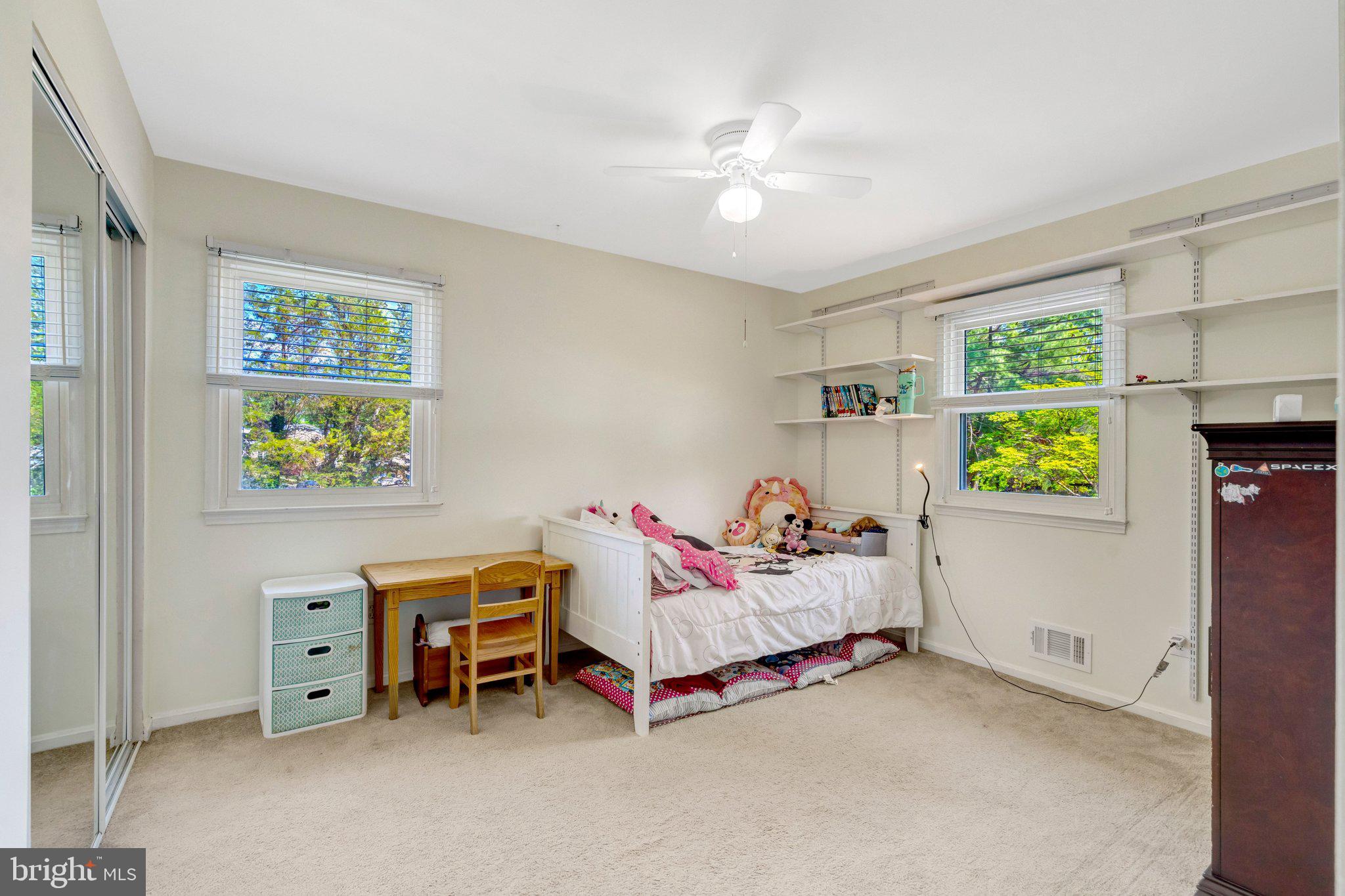 7212 Galgate Drive Springfield, VA 22153 - Photo 16 of 39 a bedroom with a bed and a window