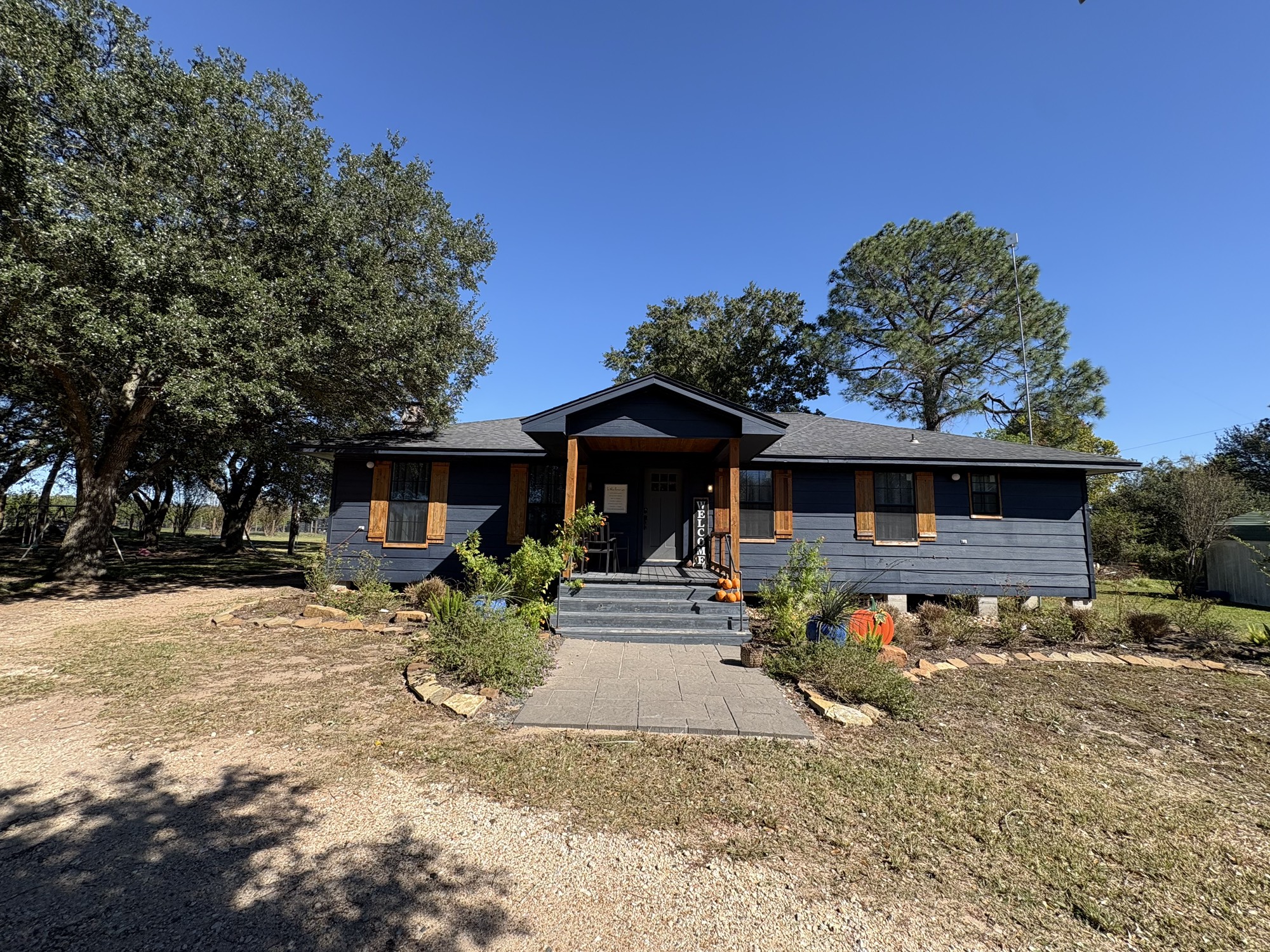 29922 Hegar Road Hockley, TX 77447 - Photo 1 of 19 a front view of a house with yard patio and fire pit