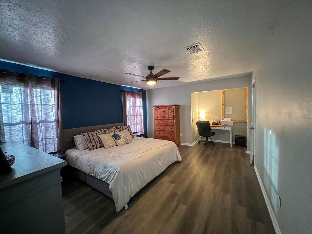 29922 Hegar Road Hockley, TX 77447 - Photo 14 of 19 a bedroom with a bed and a large window