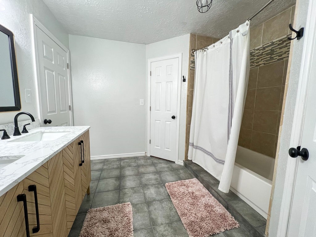 29922 Hegar Road Hockley, TX 77447 - Photo 16 of 19 a bathroom with a granite countertop sink and a mirror