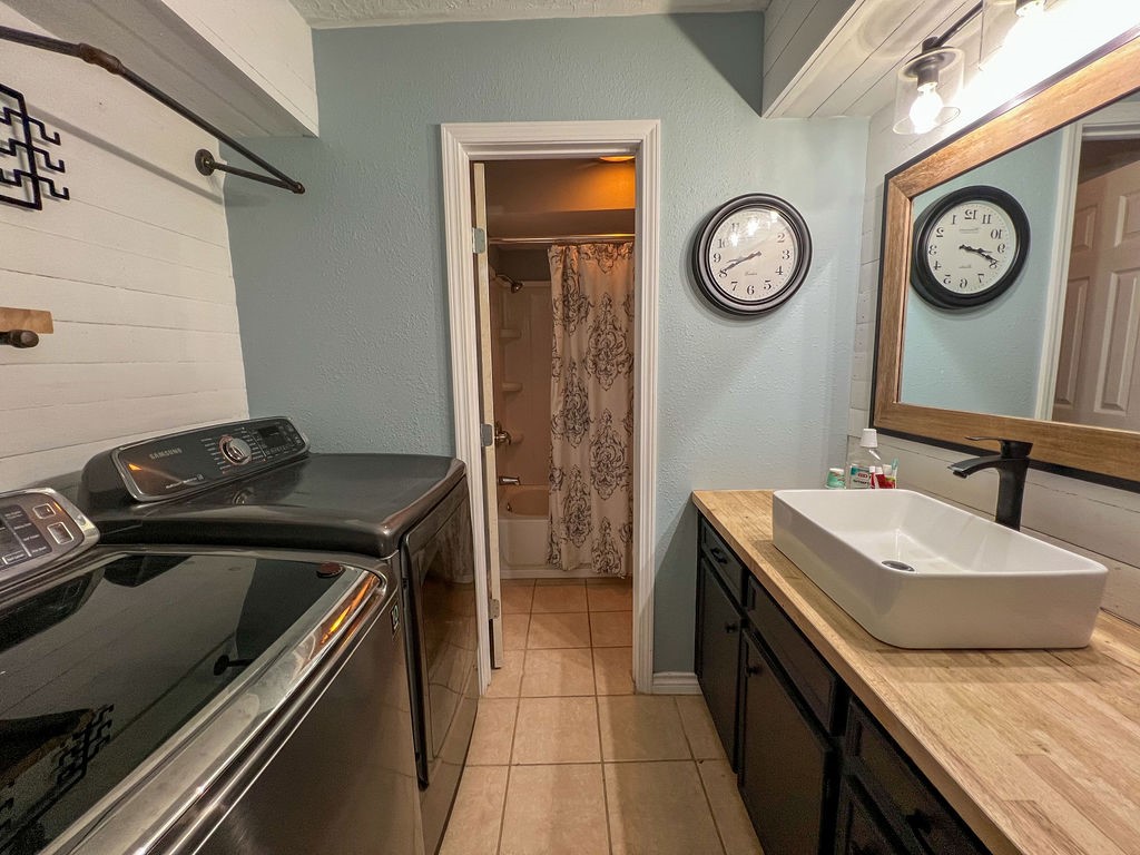 29922 Hegar Road Hockley, TX 77447 - Photo 19 of 19 a bathroom with a sink and a mirror