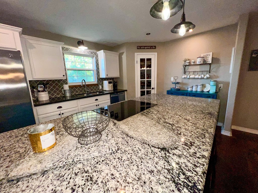 29922 Hegar Road Hockley, TX 77447 - Photo 10 of 19 a living room with furniture window and wooden floor