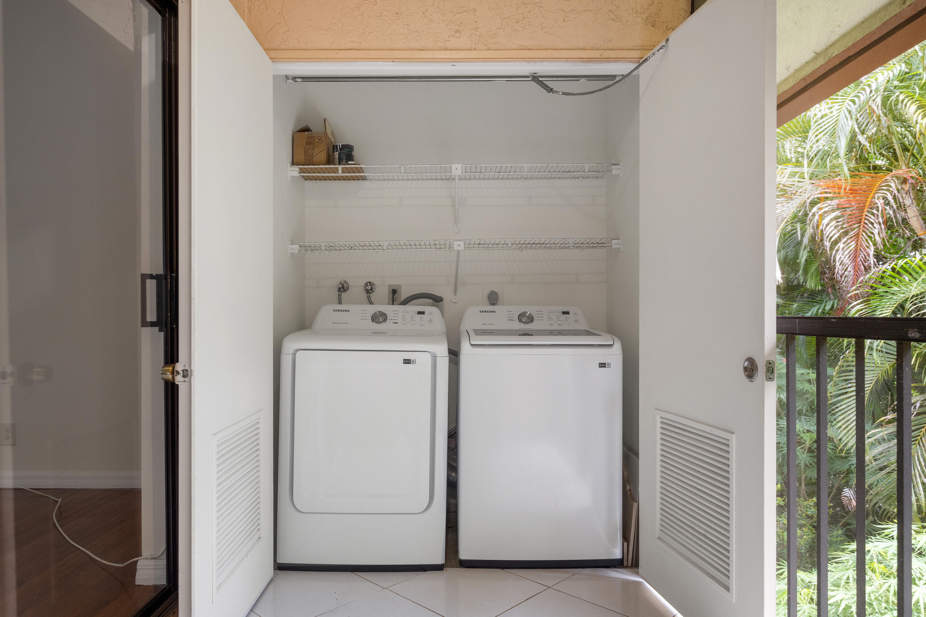 22076 Palms Way, Unit 202 Boca Raton, FL 33433 - Photo 13 of 35 a utility room with dryer and washer