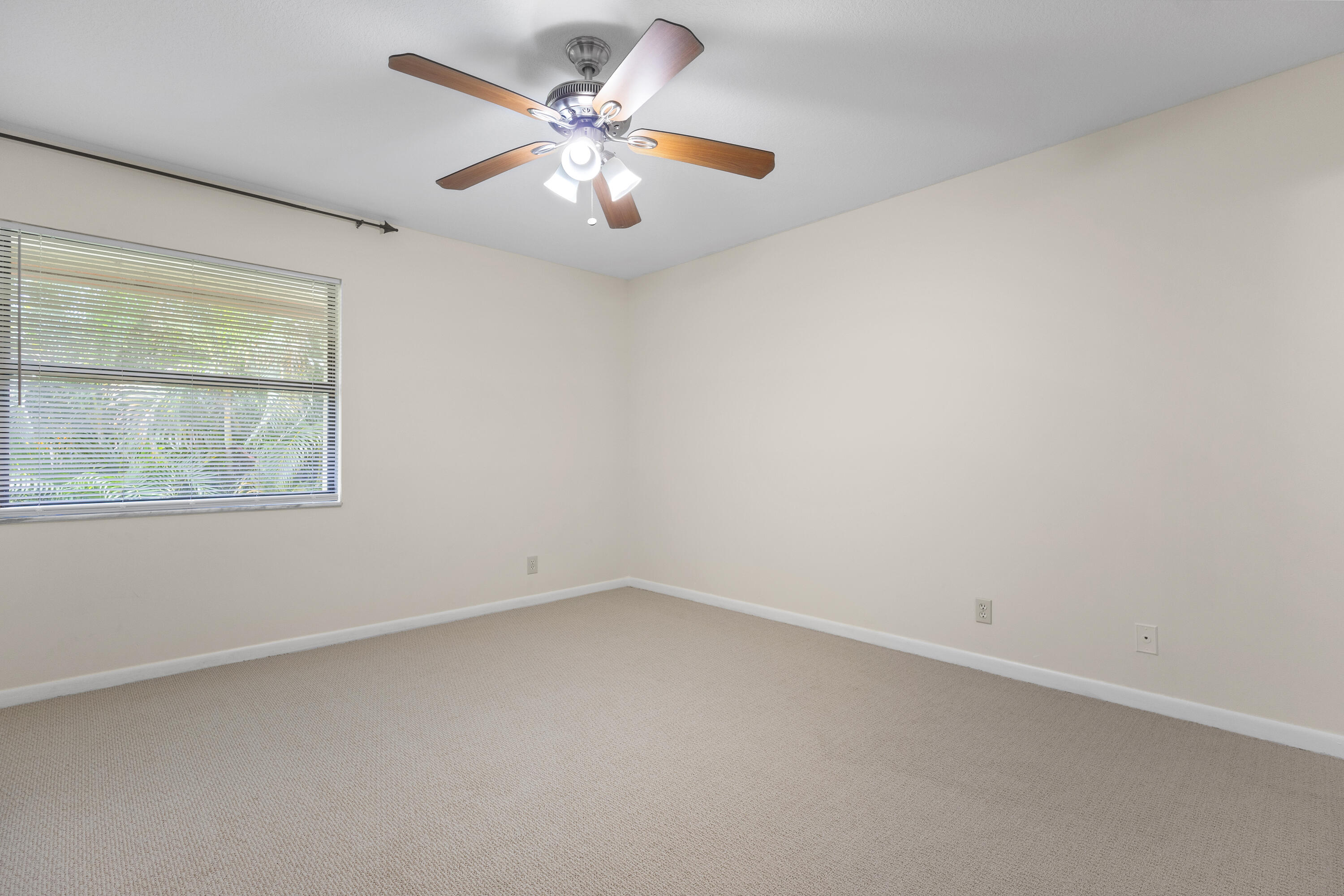 22076 Palms Way, Unit 202 Boca Raton, FL 33433 - Photo 14 of 35 an empty room with a window