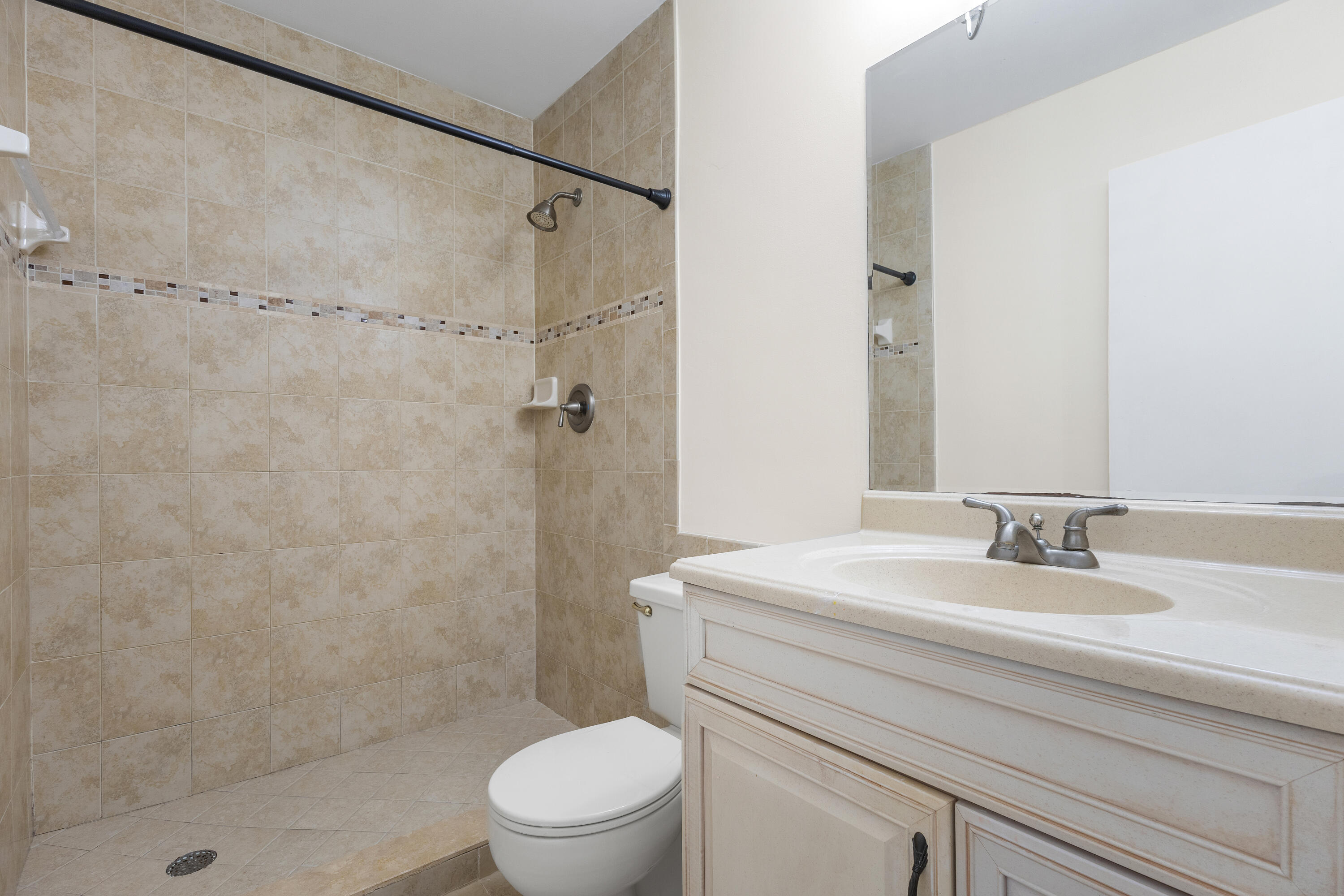 22076 Palms Way, Unit 202 Boca Raton, FL 33433 - Photo 16 of 35 a bathroom with a sink toilet and shower
