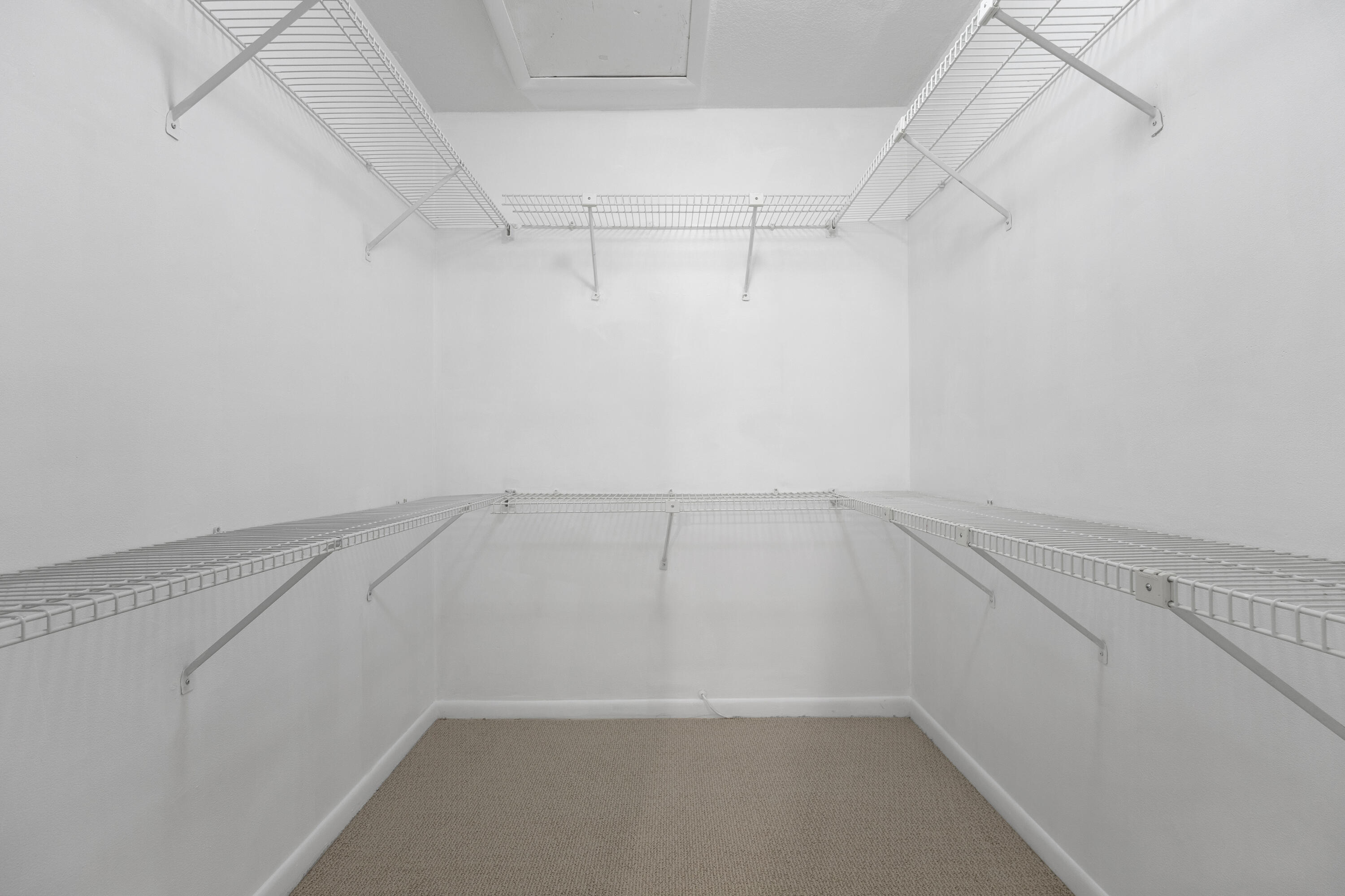 22076 Palms Way, Unit 202 Boca Raton, FL 33433 - Photo 17 of 35 a view of a room with racks on the wall