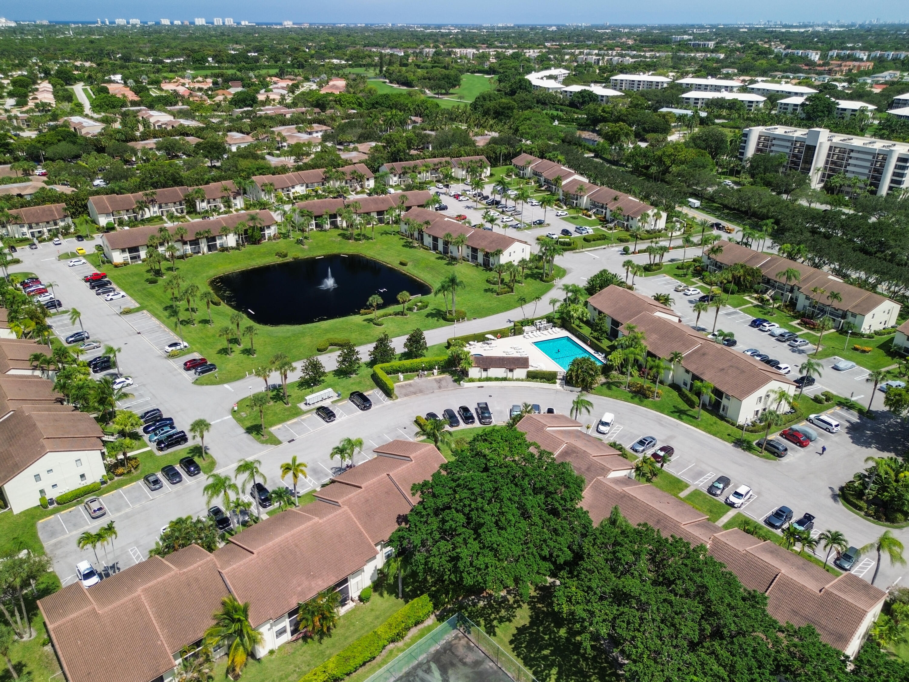 22076 Palms Way, Unit 202 Boca Raton, FL 33433 - Photo 2 of 35 an aerial view of residential houses with outdoor space