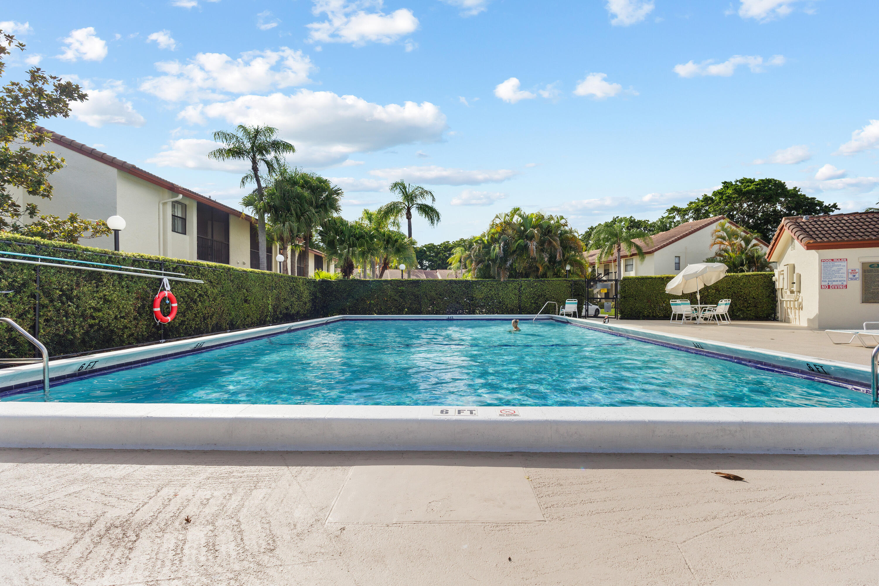 22076 Palms Way, Unit 202 Boca Raton, FL 33433 - Photo 25 of 35 a view of a yard in front of a house