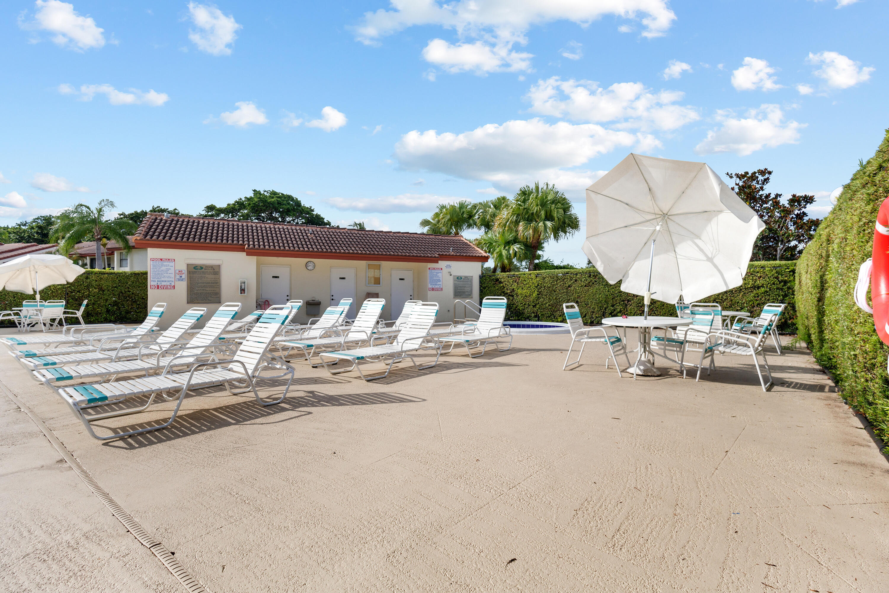 22076 Palms Way, Unit 202 Boca Raton, FL 33433 - Photo 30 of 35 a view of a terrace with sitting area