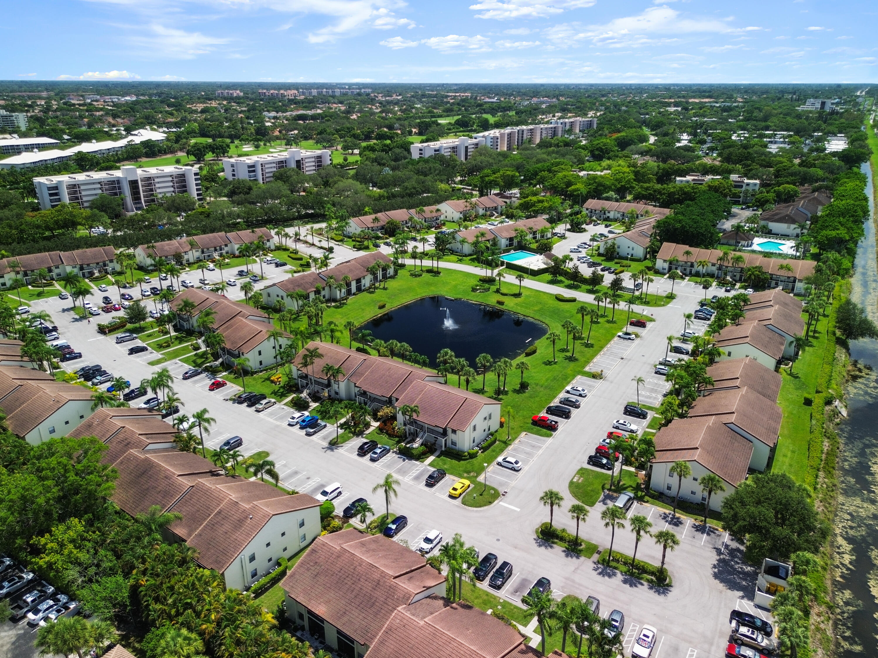 22076 Palms Way, Unit 202 Boca Raton, FL 33433 - Photo 32 of 35 an aerial view of multiple house