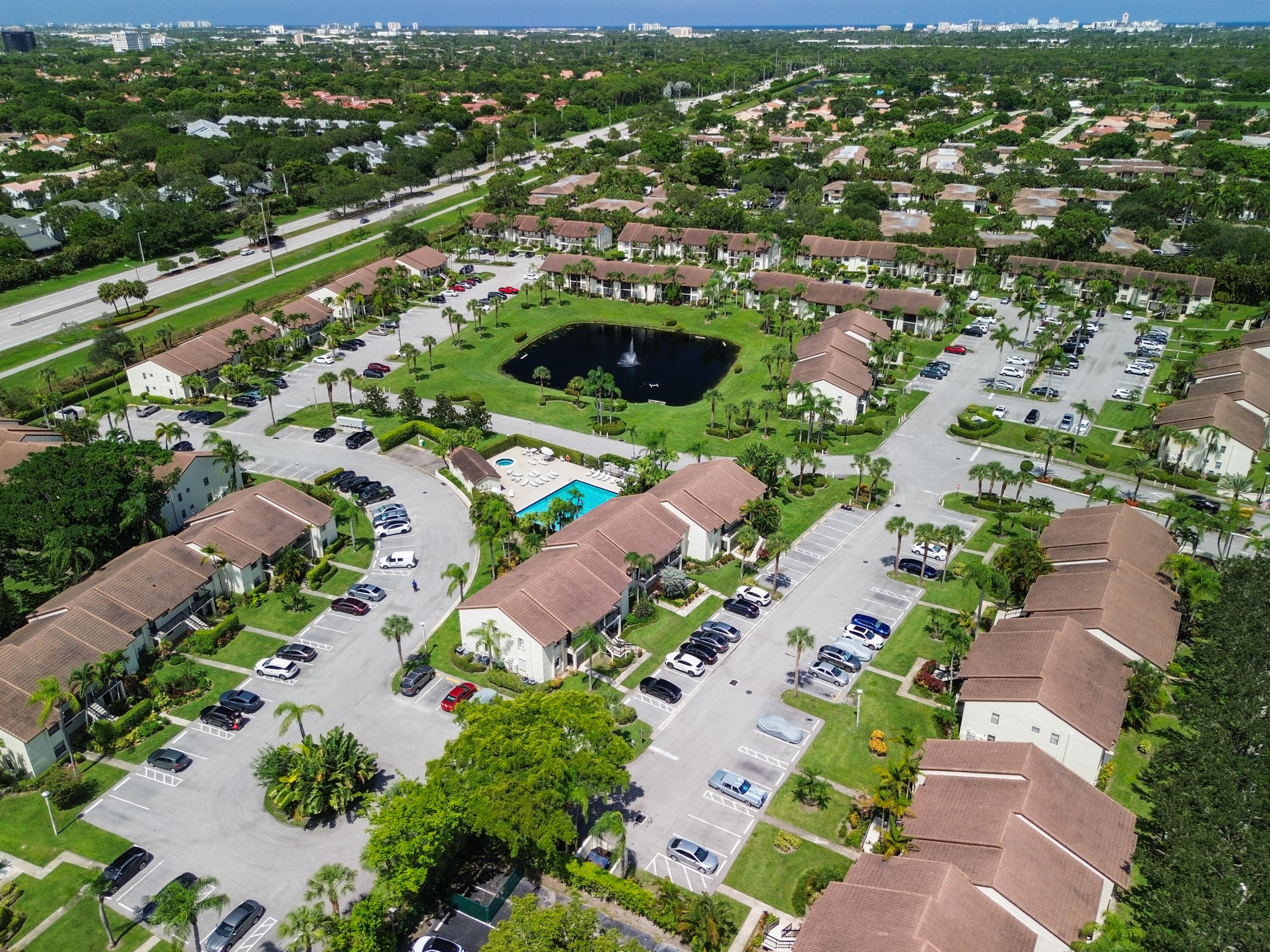 22076 Palms Way, Unit 202 Boca Raton, FL 33433 - Photo 33 of 35 an aerial view of residential houses with outdoor space