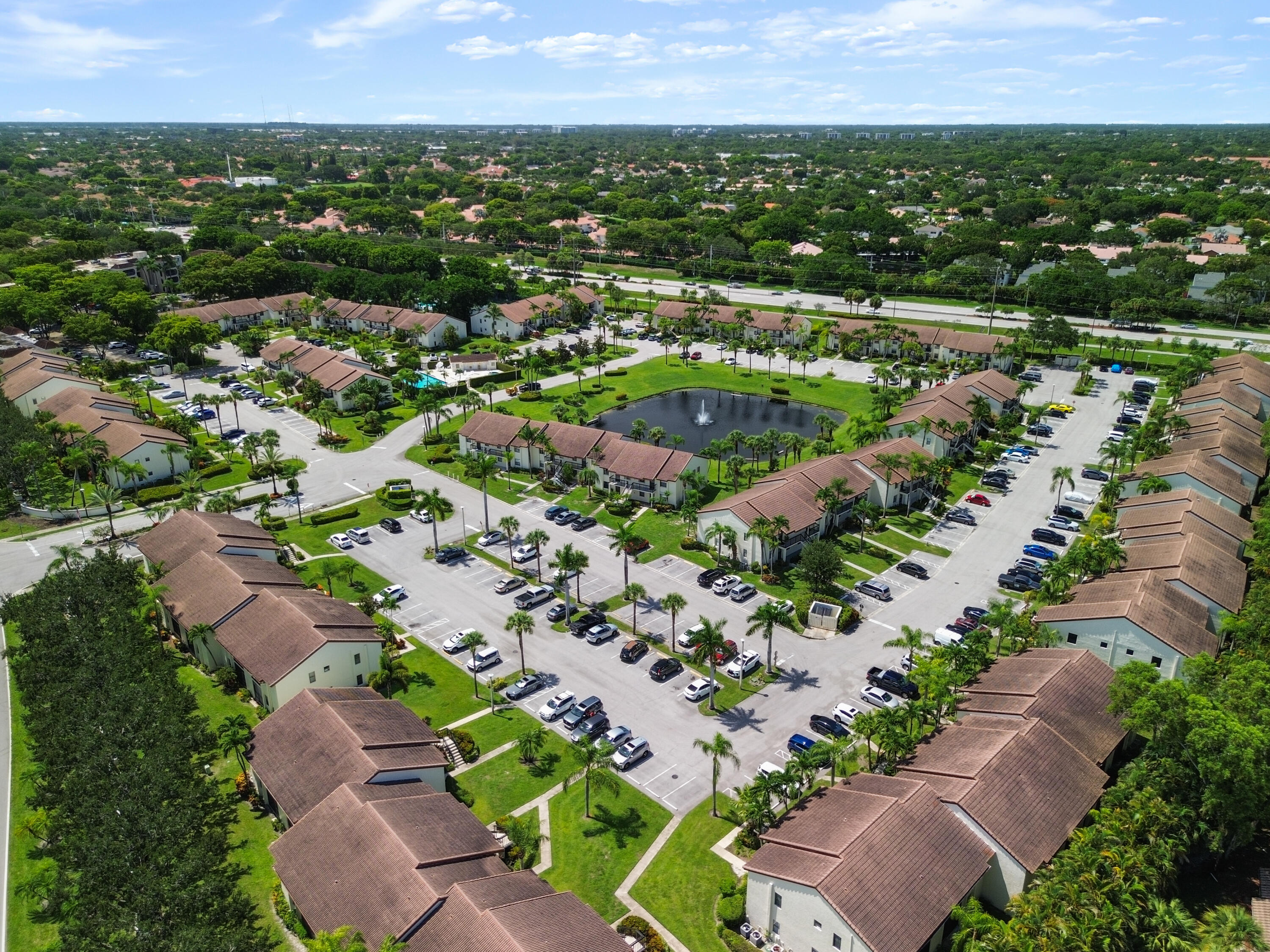 22076 Palms Way, Unit 202 Boca Raton, FL 33433 - Photo 34 of 35 an aerial view of multiple house