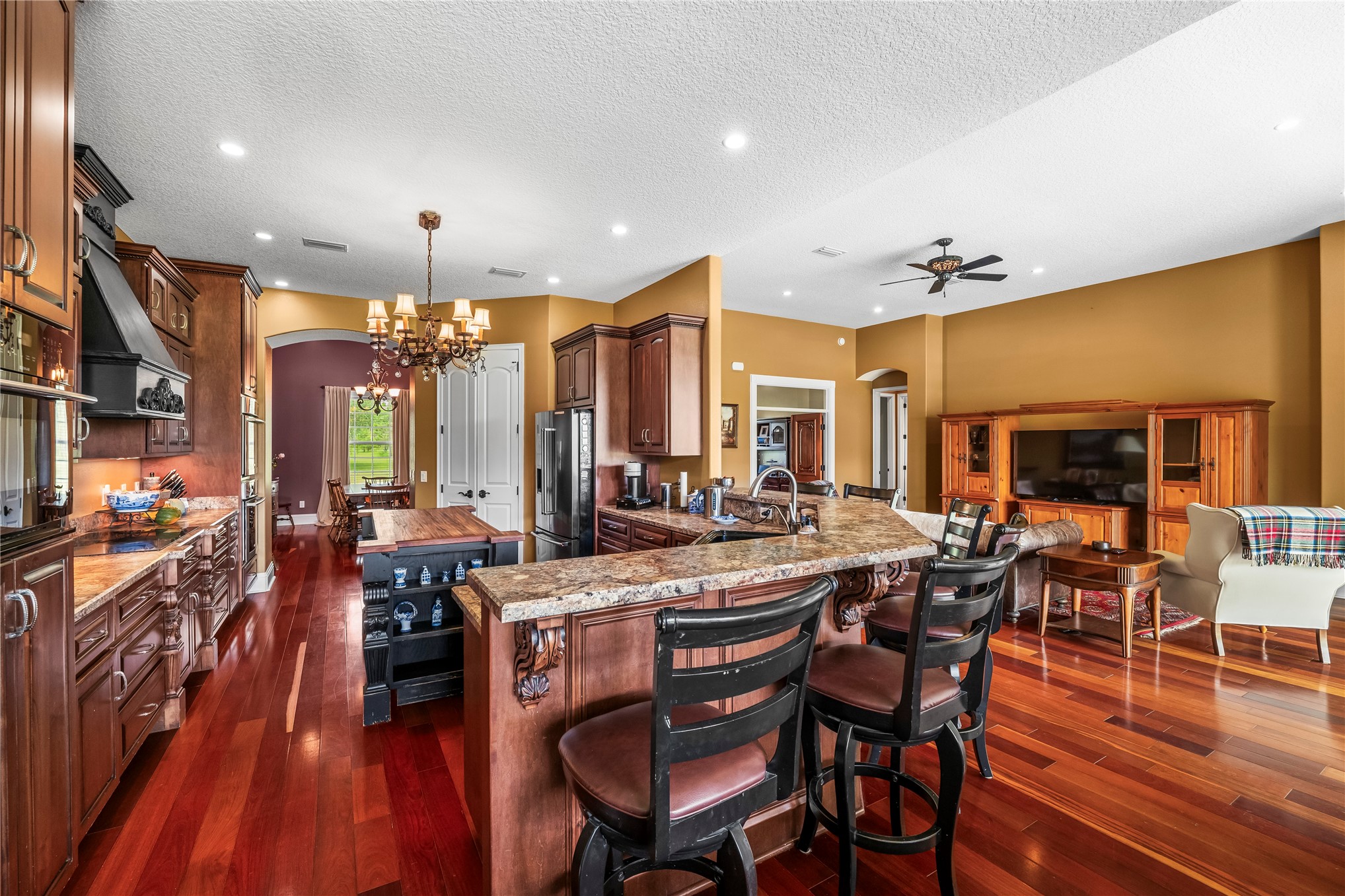 27247 Hallman Road Hilliard, FL 32046 - Photo 19 of 59 a view of a dining room with furniture window and wooden floor
