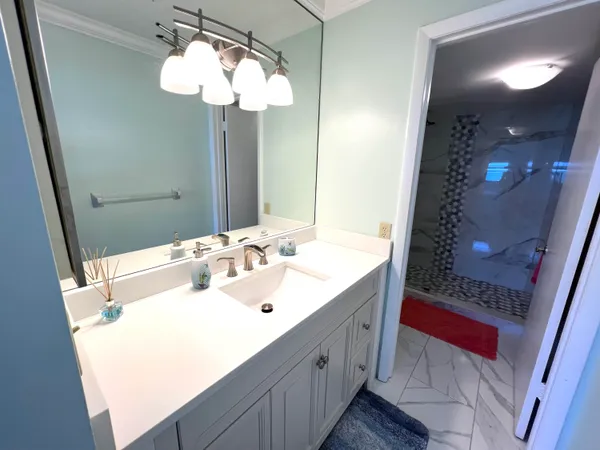 a bathroom with a sink and a mirror