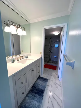a bathroom with a double vanity sink and a mirror