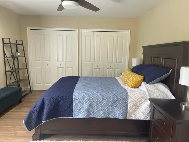 a bedroom with a bed and a walk in closet