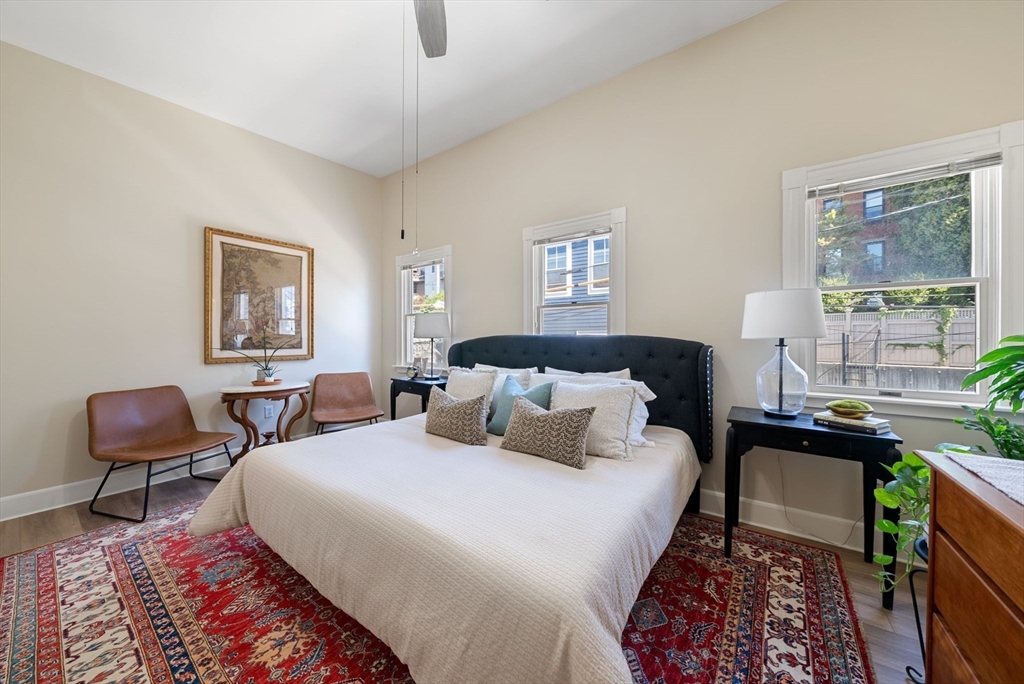 11 Wall Street Boston, MA 02129 - Photo 21 of 33 a bedroom with furniture a rug and a window