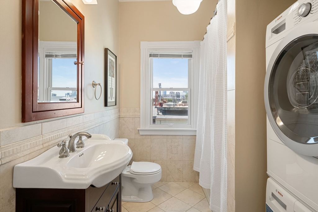 11 Wall Street Boston, MA 02129 - Photo 24 of 33 a bathroom with a sink a toilet and a mirror
