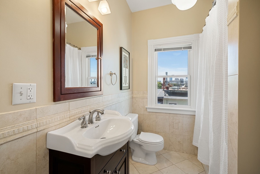 11 Wall Street Boston, MA 02129 - Photo 25 of 33 a bathroom with a sink toilet and mirror